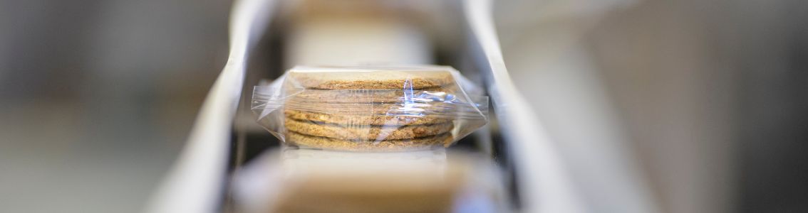 Biscuits packaging on conveyor belt